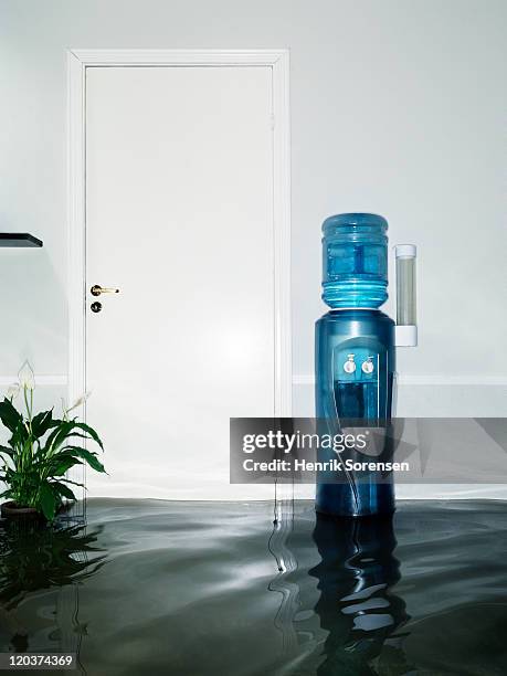 watercooler in flooded room - water cooler stock pictures, royalty-free photos & images