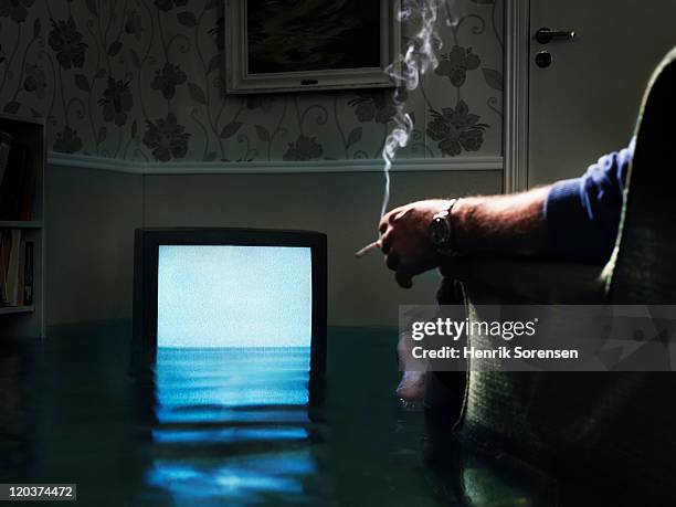 flooded tv in living room - television set smoke stock pictures, royalty-free photos & images