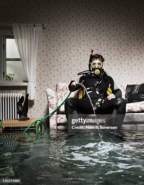 male diver in flooded room - funny mask stock-fotos und bilder