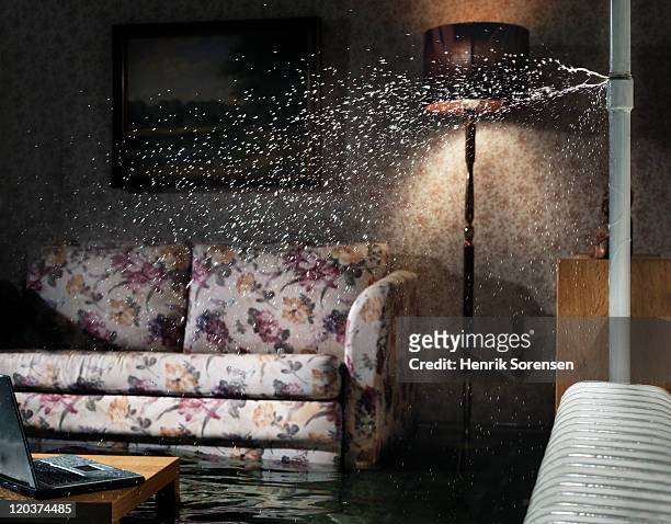 broken water pipe in flooded room - flooded room stock-fotos und bilder