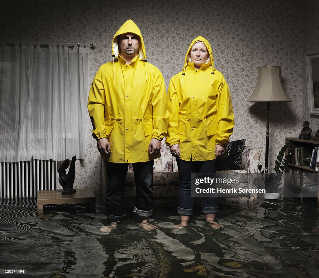 Young pair in flooded room