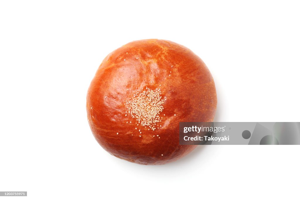 Anpan round bread with azuki red beans paste closeup isolated on white background