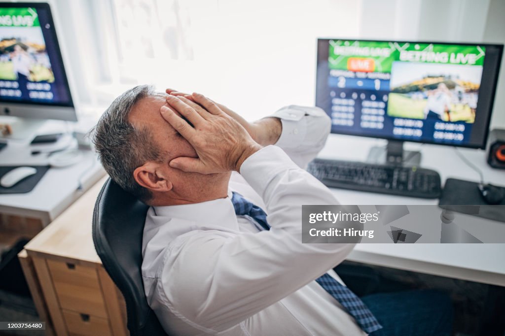 One senior business man live betting and lose game