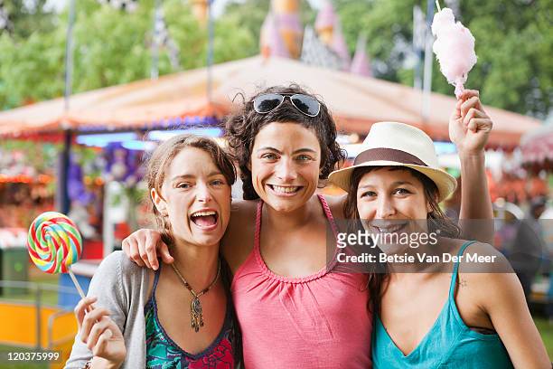 friends at funfair. - lollipops stock pictures, royalty-free photos & images