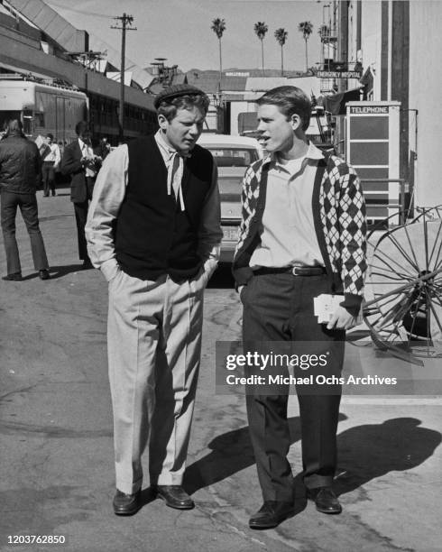 American actors Ron Howard and Donny Most on the studio lot during the filming of the television sitcom 'Happy Days', USA, 1977. The Hollywood sign...