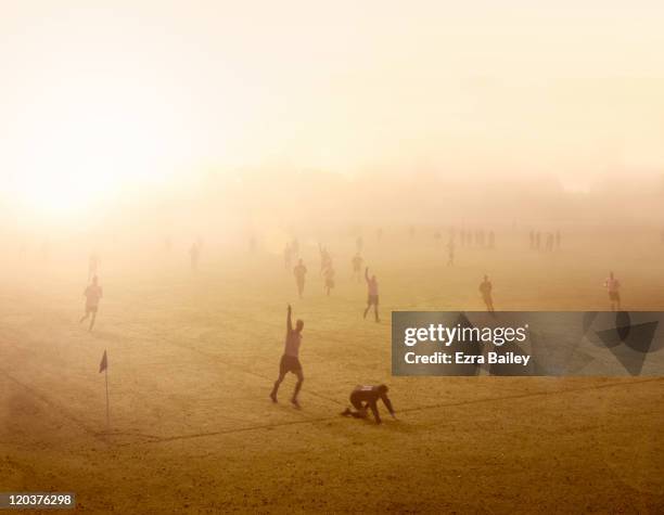 football match at sunrise - sportliga stock-fotos und bilder