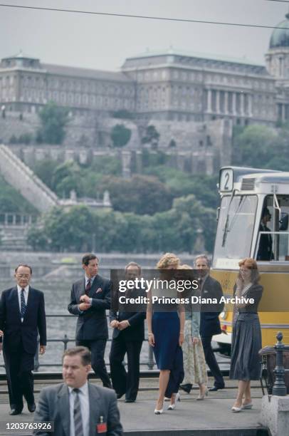 Prince Charles and Diana, Princess of Wales in front of Buda Castle in Budapest, Hungary, May 1990. Diana is wearing a blue and white dress by...