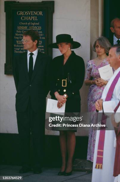 Diana, Princess of Wales attends the funeral of her friend Adrian Ward-Jackson at Grosvenor Chapel in Mayfair, London, 29th August 1991. To the left...