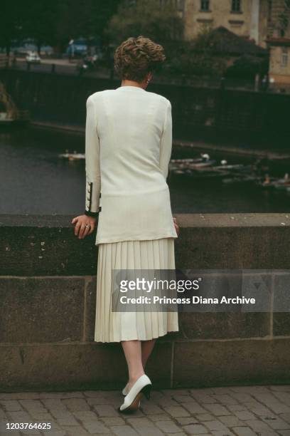 Diana, Princess of Wales visits the Charles Bridge over the Vltava River in Prague, Czechoslovakia , May 1991. She is wearing a suit by Catherine...