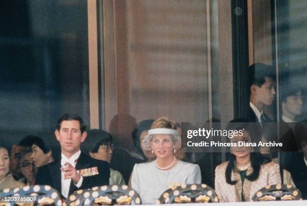 Prince Charles and Diana, Princess of Wales attend the enthronement of Emperor Akihito in Tokyo, Japan, 12th November 1990. Diana is wearing a dress...