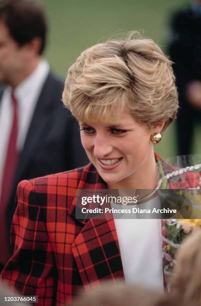 Diana, Princess of Wales visits Tenterden in Kent, 18th October 1990. She is wearing a red and black checked suit by Escada.