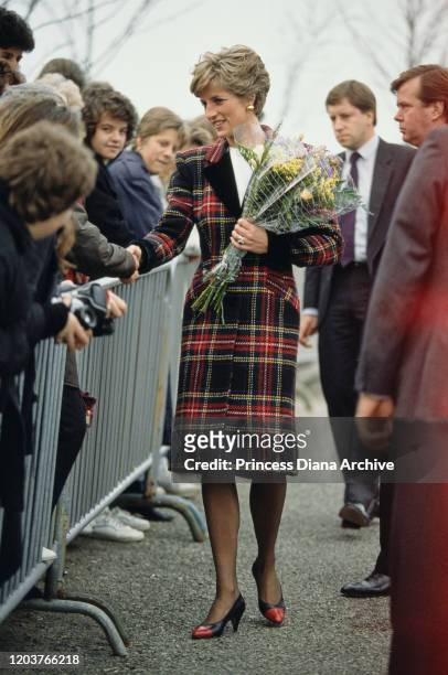 Diana, Princess of Wales meets the public in St Austell, Cornwall, January 1991. She is wearing a tartan coat-dress by Catherine Walker.