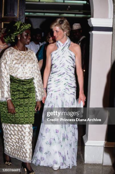 Diana, Princess of Wales with Maryam Babangida, the wife of the Nigerian President, during a presidential banquet in Lagos, Nigeria, March 1990....