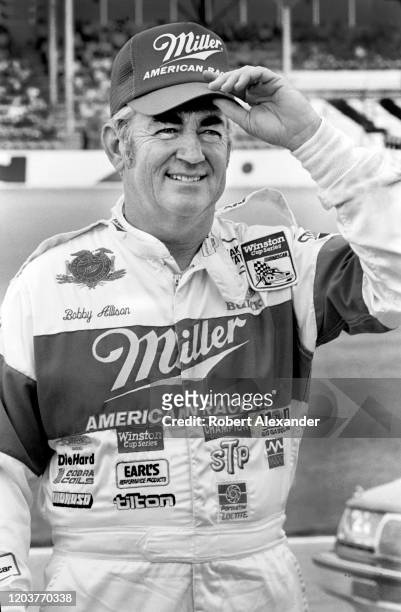 Driver Bobby Allison poses for photographers prior to the start of the 1986 Daytona 500 stock car race at Daytona International Speedway in Daytona...