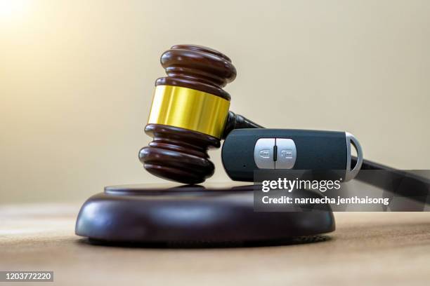 close up of wooden judge gavel and car keys over soundboard - car studio shot stock pictures, royalty-free photos & images