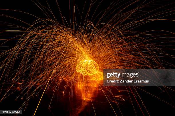 steel wool sparks - burning steel wool firework stock pictures, royalty-free photos & images