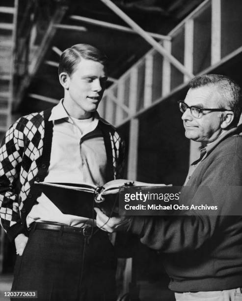 American actor Ron Howard with a script supervisor on the set of the television sitcom 'Happy Days', 1974.