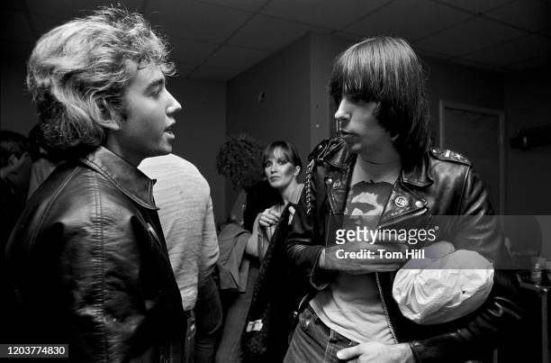 Johnny Ramone of The Ramones talks with a local musician in the dressing room after performing at The Agora Ballroom on January 30, 1979 in Atlanta,...
