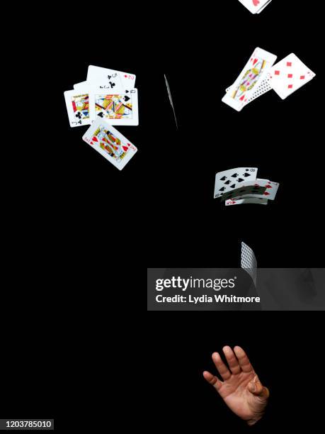 anonymous hands perform a magic tric - magic card trick stock pictures, royalty-free photos & images