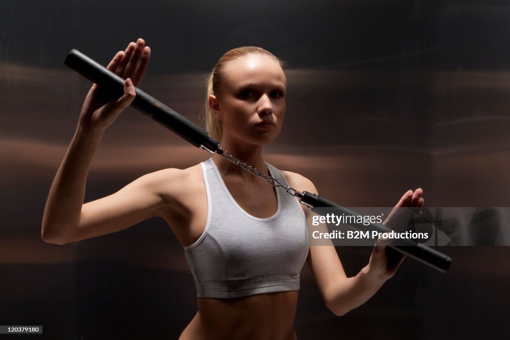 Portrait of young woman exercising