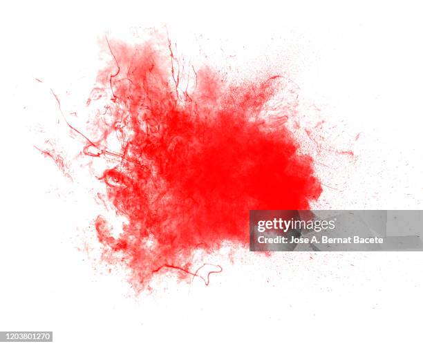 explosion by an impact of a cloud of particles of powder of red color on a white background. - fireworks on white stockfoto's en -beelden