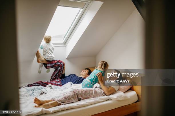 Family Waking Up In Bed High-Res Stock Photo - Getty Images