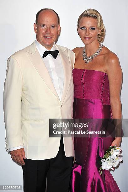 Prince Albert II of Monaco and Princess Charlene of Monaco attend the 63rd Red Cross Ball at the Sporting Monte-Carlo on August 5, 2011 in...