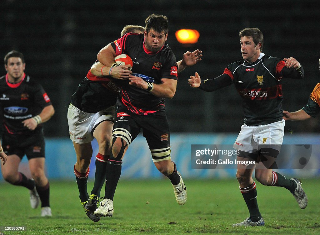 Farmapes Rugby Doppies le Roux of the Pumas tackled during the Absa Currie Cup match ...