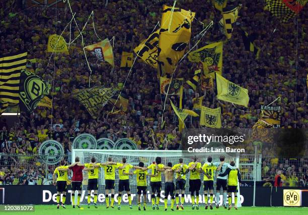 Kevin Grosskreutz of Dortmund celebrates with his team mates and the fans after winning the Bundesliga match between Borussia Dortmund and Hamburger...