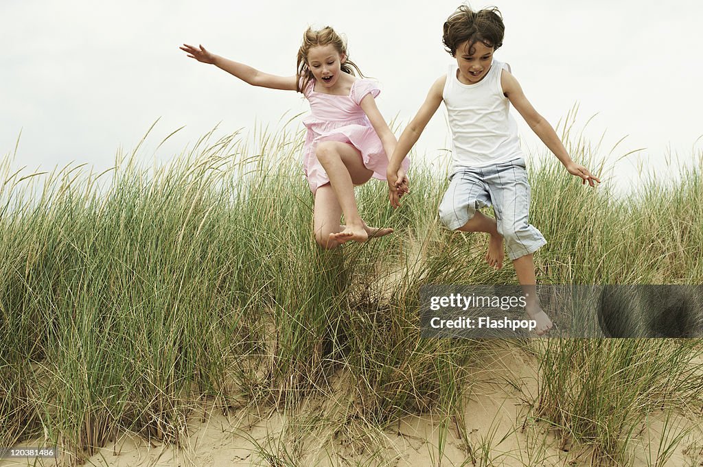 Two children playing at the beach