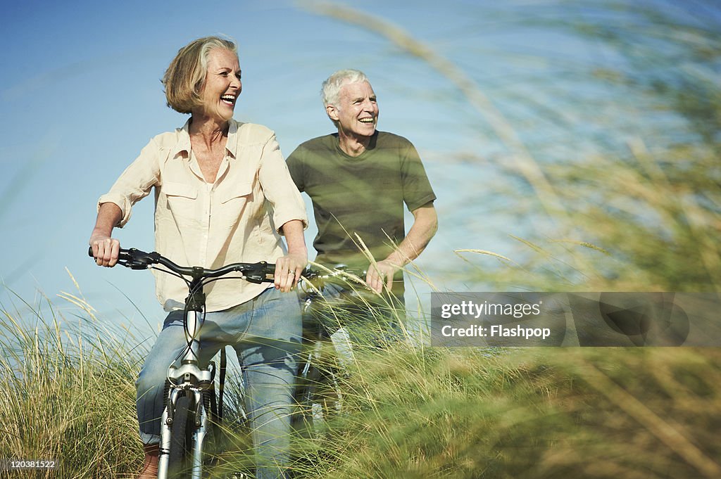 Senior couple enjoying day out on their bicycles
