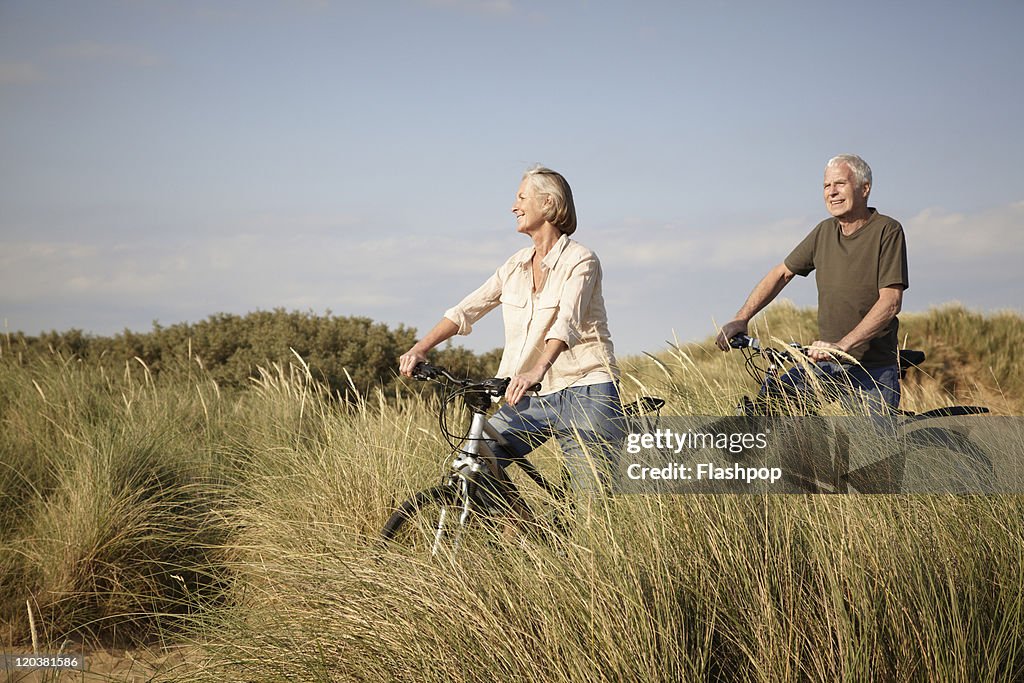 Senior couple enjoying day out on their bicycles