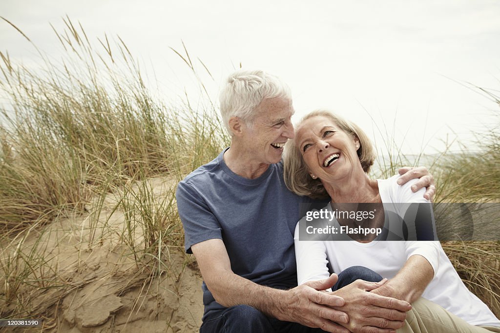 Senior couple enjoying day out at the beach