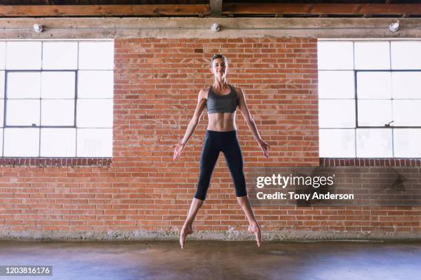 woman ballet dancer rehearsing in studio - dedication brick stock pictures, royalty-free photos & images