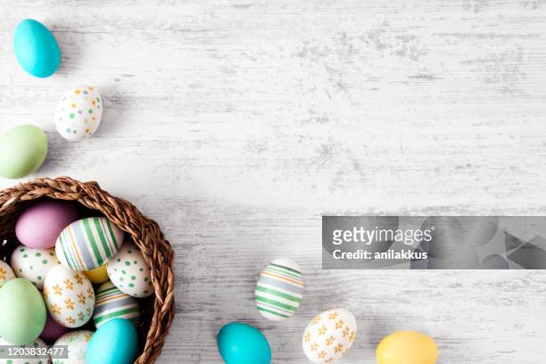 easter eggs on old white wood background - easter stock pictures, royalty-free photos & images