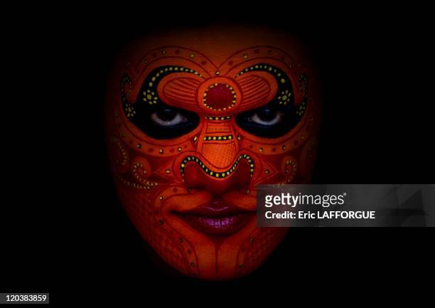 Theyyam dancer in Tellichery, Kerala, India on February 23, 2008 - It takes hours to make the Theyyam dancer s make up, which will resist to dance...
