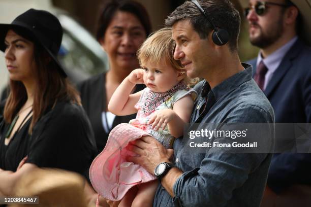 Neve Te Aroha Arden Gayford, with her dad Clarke Gayford, listens to her mother Prime Minister Jacinda Ardern speak at the upper Treaty grounds Te...