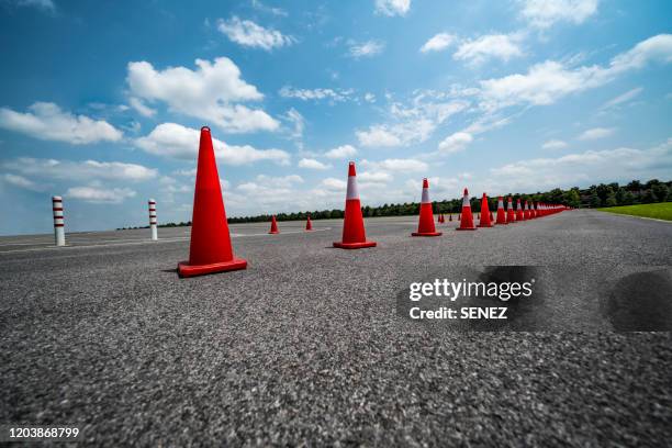 traffic cone,an image of cautions on asphalt road - cone shape stock pictures, royalty-free photos & images