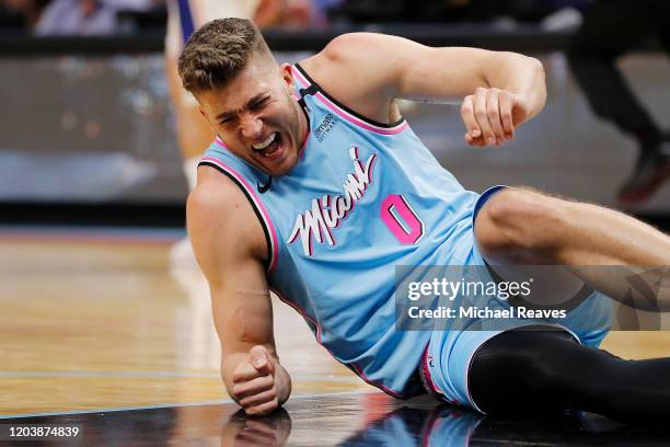 Meyers Leonard of the Miami Heat reacts after being injured against the Philadelphia 76ers during the second half at American Airlines Arena on...