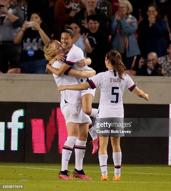 Samantha Mewis of United States, left, celebrates her goal with Christen Press and Kelley O'Hara against Costa Rica during a Group A - 2020 CONCACAF...