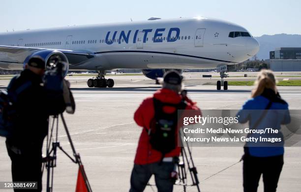 Members of the media watch as the San Francisco 49ers arrive t Norman Y. Mineta San Jose International Airport after their return from Super Bowl LIV...
