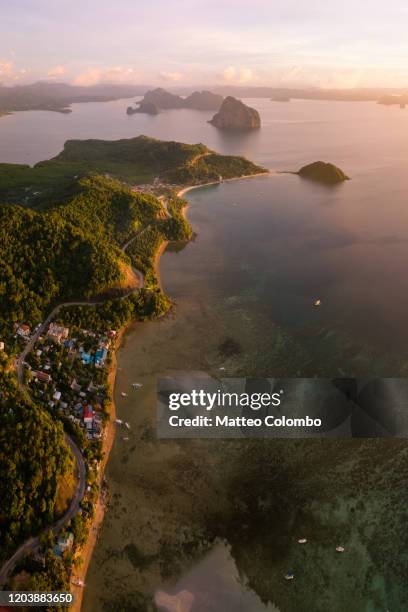 sunset on the coast, el nido, palawan, philippines - el nido stock pictures, royalty-free photos & images