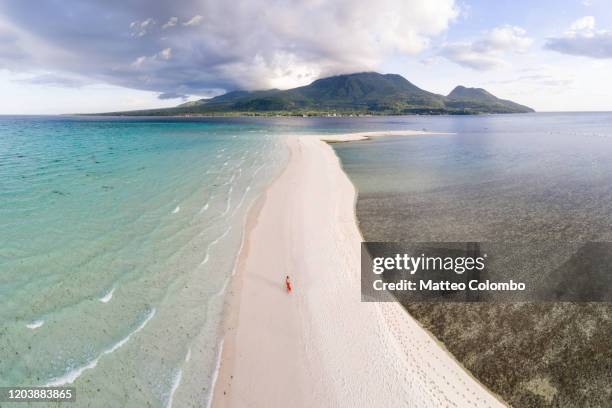 woman walking on white island, camiguin, philippines - los alfaques location fotografías e imágenes de stock