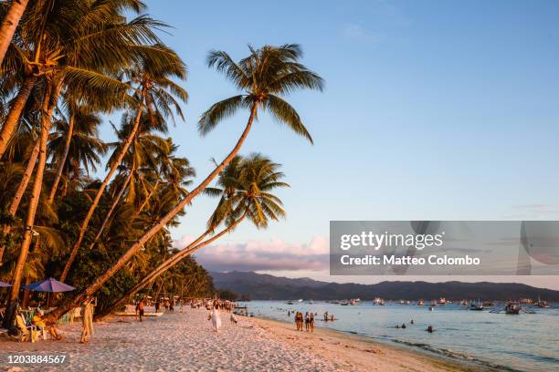 sunset at white beach, boracay island, philippines - boracay beach stock pictures, royalty-free photos & images