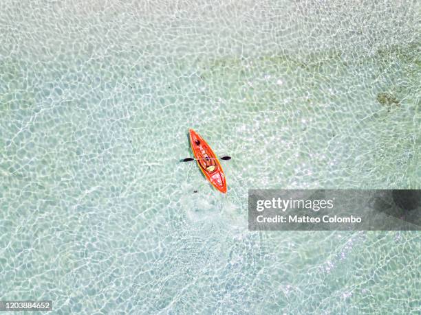 drone view of woman kayaking, philippines - kayaking aerial stock pictures, royalty-free photos & images