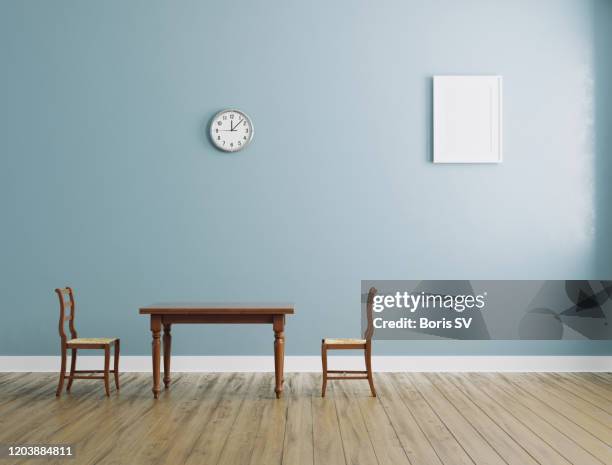 empty room with wooden table, chairs and clock on the wall - wainscoting stock pictures, royalty-free photos & images