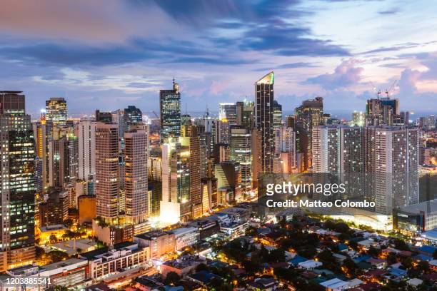 makati skyline at dusk, manila, philippines - philippines stock pictures, royalty-free photos & images