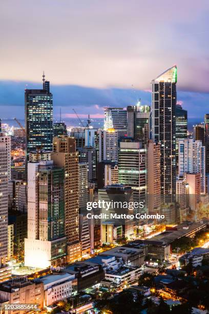 makati skyscrapers at dusk, manila, philippines - makati stock pictures, royalty-free photos & images