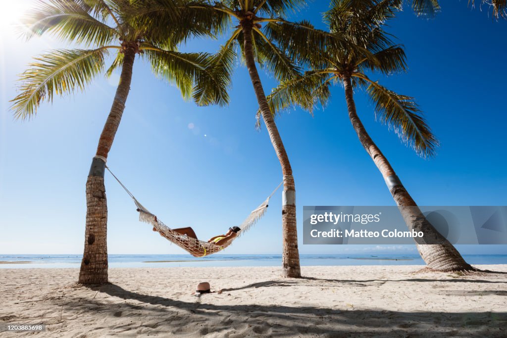 Woman relaxing in a hammock, Panglao, Bohol, Philippines