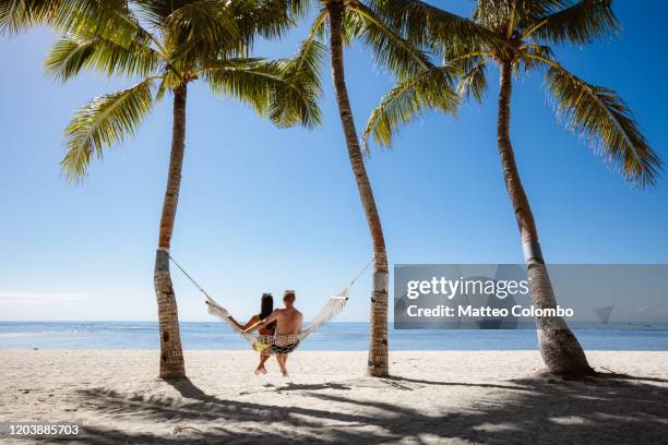 adult couple on a hammock, panglao, bohol, philippines - couple paysage asie photos et images de collection